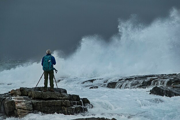 A man watches the tide